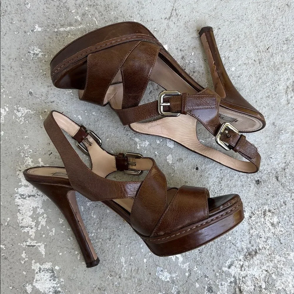 Prada crisscross open toe platforms